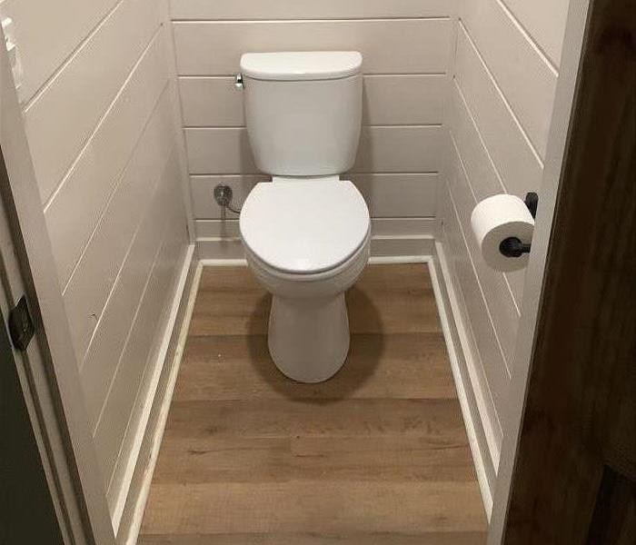 Toilet room affected by water damage