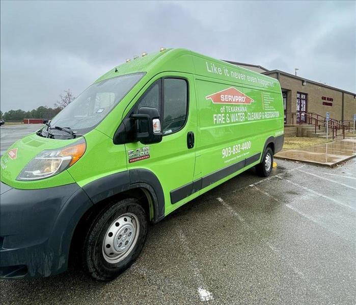 Green SERVPRO van backed in